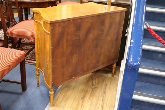 A Sheraton style serpentine side cabinet W.100cm